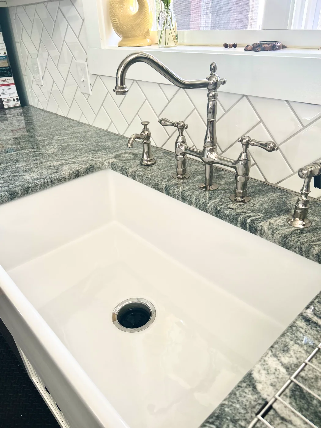 Farmhouse sink and fixtures left gleaming